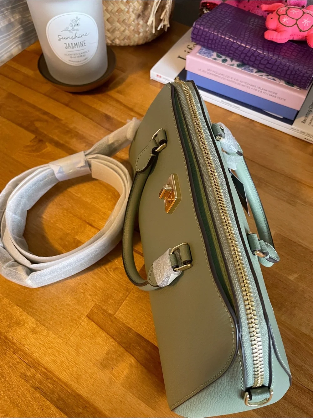 The Kate Spade KK114 refers specifically to the Phoebe East West Satchel